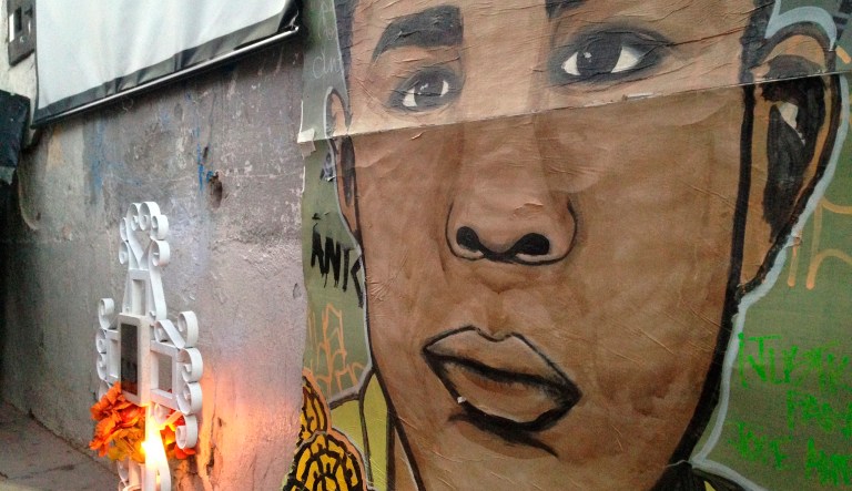 A poster in the likeness of Jose Antonio Elena Rodriguez hangs next to a makeshift memorial, where he was fatally shot two years ago by U.S. Border Patrol near the Mexico-U.S border.
