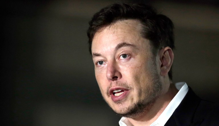 Tesla CEO Elon Musk speaks at a news conference.