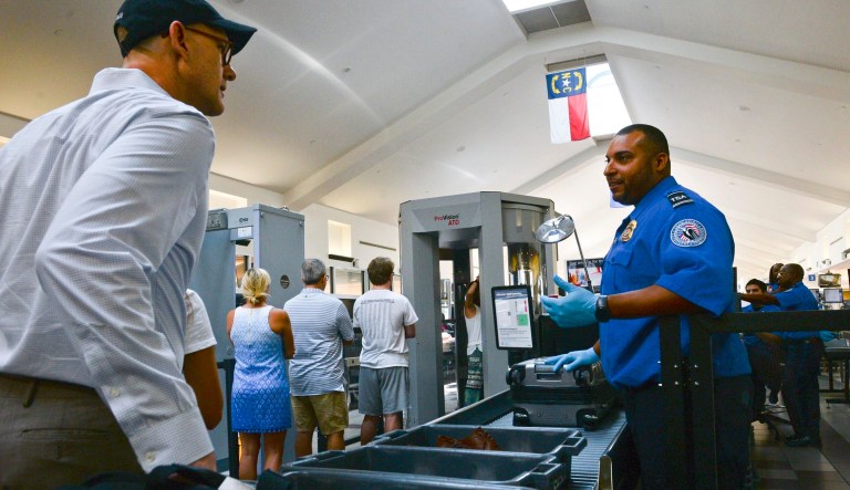 Savannah/Hilton Head International Airport TSA Lead Officer Darrell Wade talks to passengers as they make their way through the TSA checkpoint on Thursday, Aug. 9, 2018. On July 20, Wade grabbed a smoking bag from the TSA checkpoint and carried it away from passengers. It turned out to be a malfunctioning vape battery.
