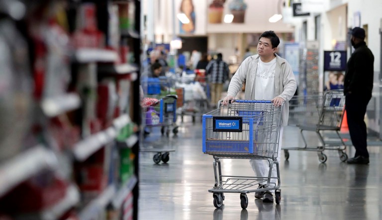 A man pushes a cart while shopping at a Walmart store in North Bergen, New Jersey.
