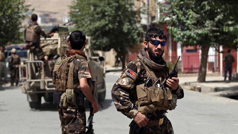 Afghan security forces arrive at the site of an attack by gunmen, in Kabul, Afghanistan.