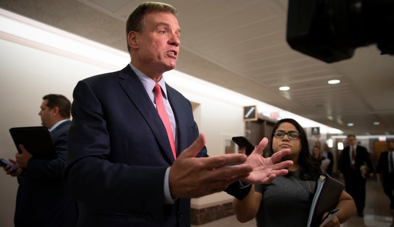 Sen. Mark Warner, D-Va., vice-chair of the Senate Intelligence Committee, takes questions from reporters on Capitol Hill in Washington, Tuesday, Aug. 21, 2018.