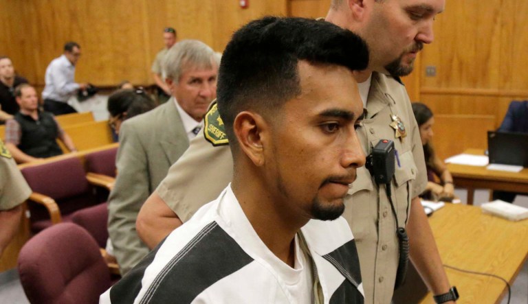 Cristhian Bahena Rivera is led into the courtroom for his initial court appearance at the Poweshiek County Courthouse in Montezuma, Iowa. Rivera is charged with first-degree murder in the death of Mollie Tibbetts, who disappeared July 18 from Brooklyn, Iowa.