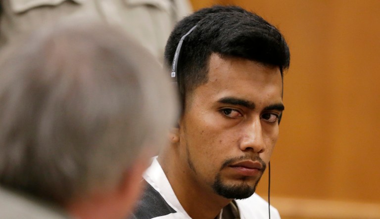 Cristhian Bahena Rivera, charged with the first-degree murder of Mollie Tibbetts, speaks with his attorney during his initial court appearance on Aug. 22, 2018, at the Poweshiek County Courthouse in Montezuma, Iowa.