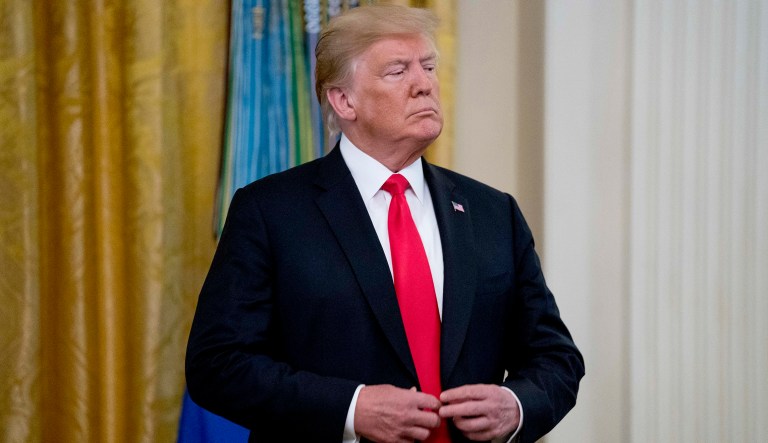 President Trump arrives at a ceremony in the East Room of the White House in Washington, Aug. 22, 2018.