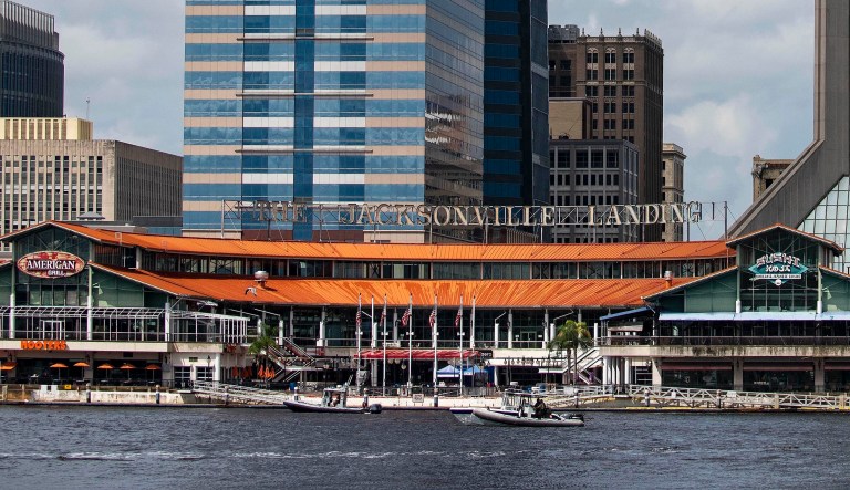 The Coast Guard patrols the St. John's River outside of the Jacksonville Landing area in Jacksonville, Fla., Sunday, Aug. 26, 2018. Florida authorities are reporting multiple fatalities after a mass shooting at the riverfront mall in Jacksonville that was hosting a video game tournament.