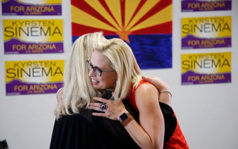 Rep. Kyrsten Sinema, D-Ariz., hugs a supporter at a Democratic campaign office on primary election day Tuesday, Aug. 28, 2018, in Phoenix. Sinema is seeking the current U.S. Senate seat occupied by outgoing Republican Sen. Jeff Flake.