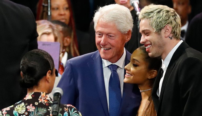 Former President Bill Clinton poses for a photo with Ariana Grande (center) and Pete Davidson (right) during the funeral service for Aretha Franklin at Greater Grace Temple in Detroit.