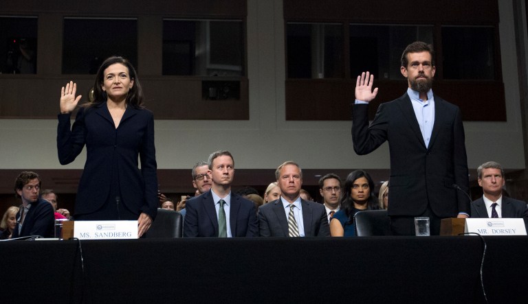 Facebook COO Sheryl Sandberg, left, accompanied by Twitter CEO Jack Dorsey are sworn in before the Senate Intelligence Committee hearing on 'Foreign Influence Operations and Their Use of Social Media Platforms' on Capitol Hill in D.C.