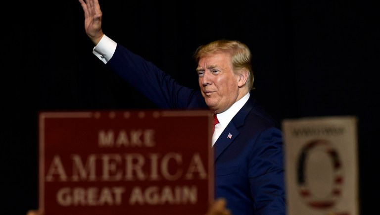 President Trump walks off of the stage following a fundraiser in Sioux Falls, S.D.