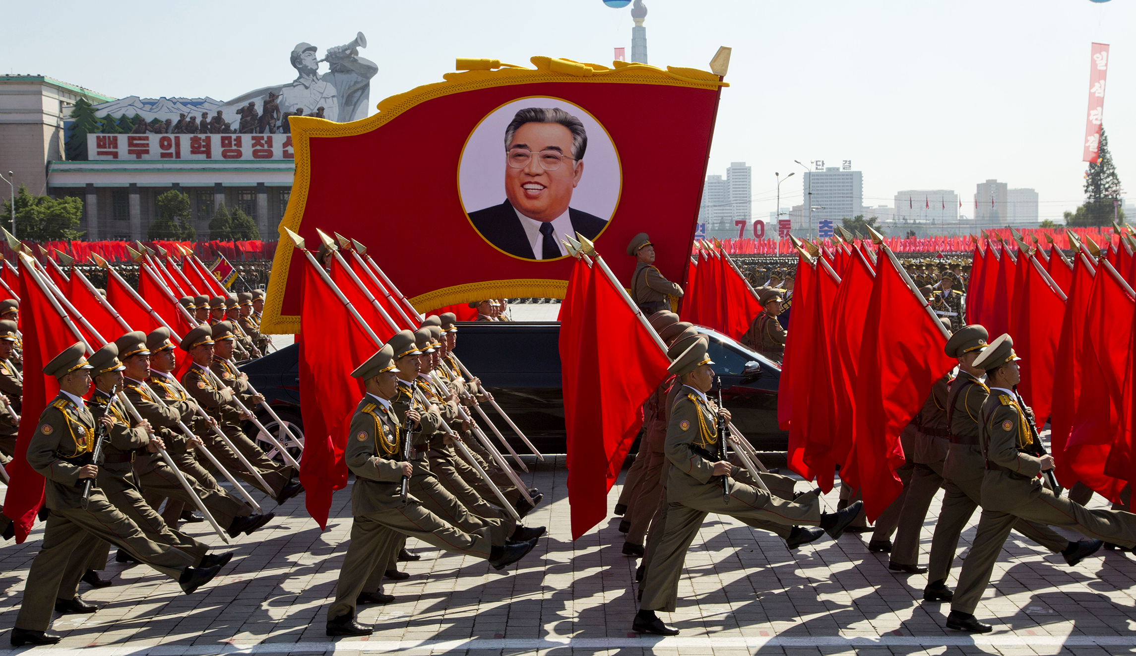 North Korea stages huge parade, holds back on advanced missiles