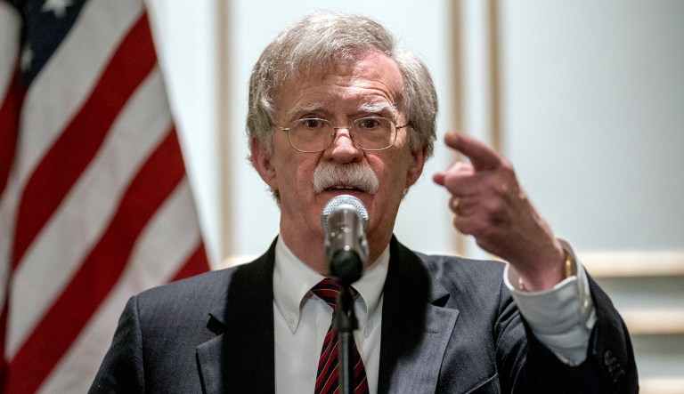 National security adviser John Bolton calls on a reporter during a news conference.