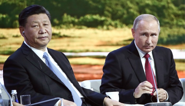 Russian President Vladimir Putin and Chinese President Xi Jinping attend a plenary session at the Eastern Economic Forum in Vladivostok, Russia, Wednesday, Sept. 12, 2018.