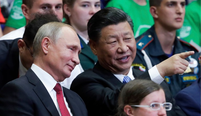 Russian President Vladimir Putin (left) and Chinese President Xi Jinping appear at an event.