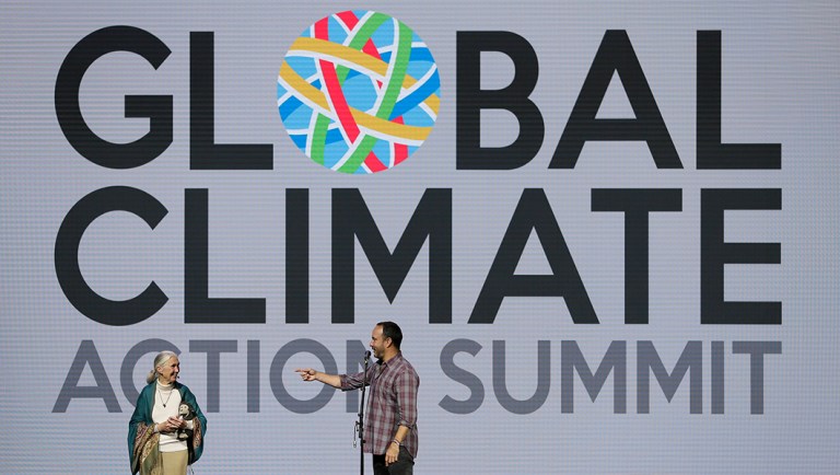 Jane Goodall, Primatologist and United Nations Messenger of Peace, is greeted on stage by singer Dave Matthews during the Global Action Climate Summit.