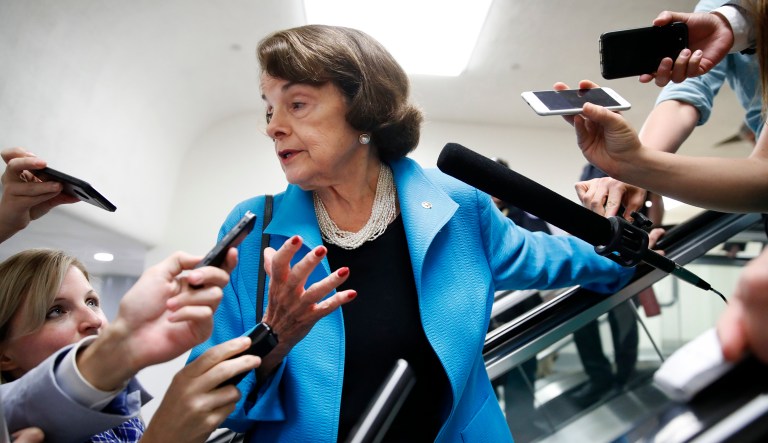 Sen. Dianne Feinstein, D-Calif., is surrounded by reporters as she arrives for a vote, Sept. 18, 2018, on Capitol Hill in Washington.