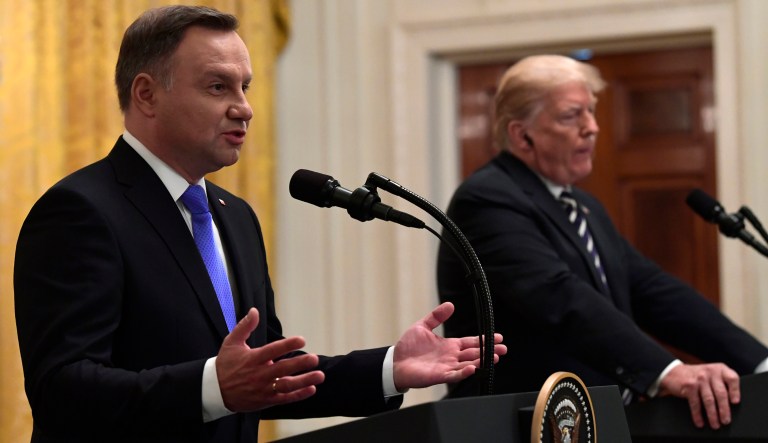 President Donald Trump, right, listens as Polish President Andrzej Duda, left, speaks during a news conference in the East Room of the White House in Washington, Tuesday, Sept. 18, 2018.