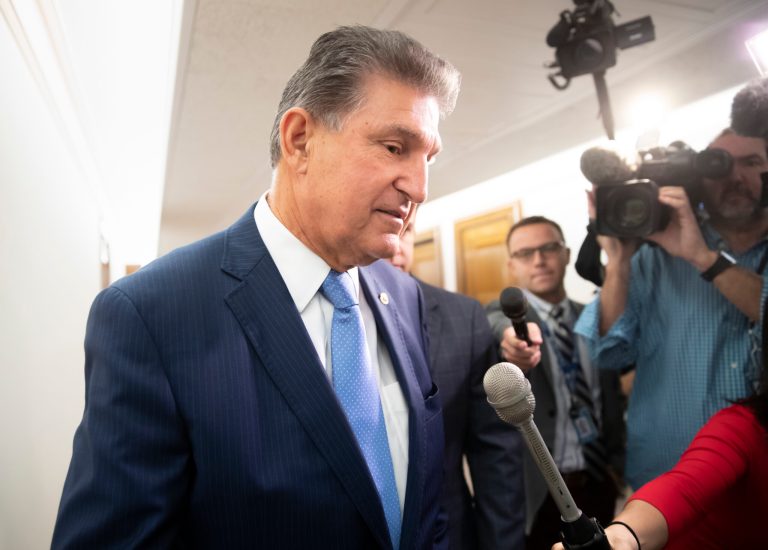 Sen. Joe Manchin, D-W.Va., talks to reporters about President Donald Trump's embattled Supreme Court nominee, Brett Kavanaugh, on Capitol Hill in Washington, Tuesday, Sept. 25, 2018.