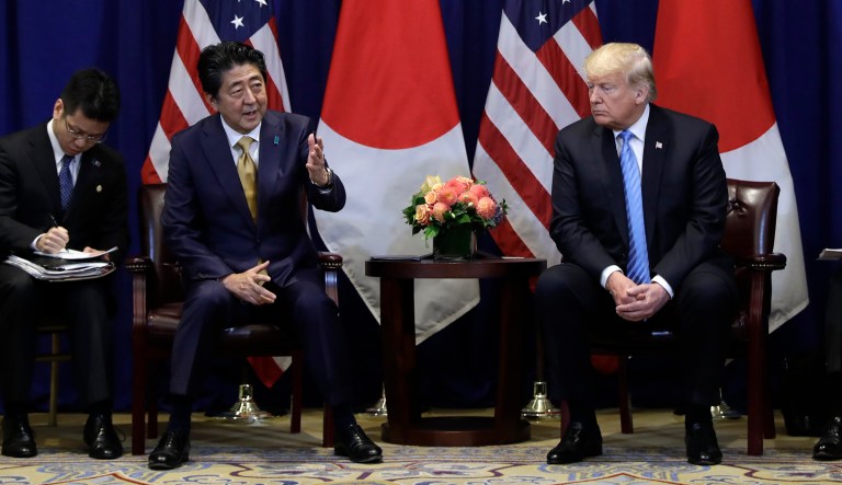 President Trump listens as he meets with Japanese Prime Minister Shinzo Abe.