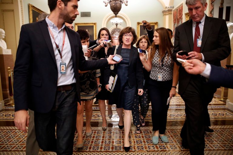 Sen. Susan Collins, R-Maine, is surrounded by reporters asking her questions about Supreme Court nominee Brett Kavanaugh, Wednesday, Sept. 26, 2018, on Capitol Hill in Washington.