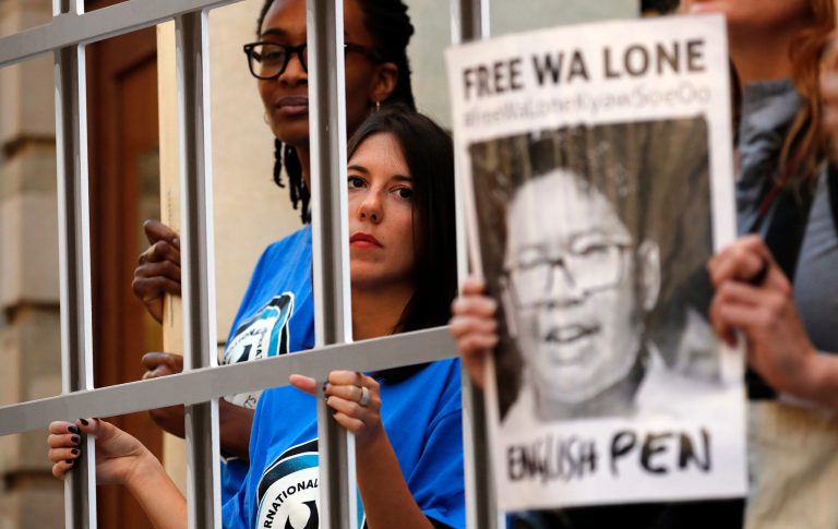 Protestors demonstrate by holding a symbolic fence in front of the Myanmar Embassy to petition for the release of Reuters journalists Wa Lone and Kyaw Soe Oo.