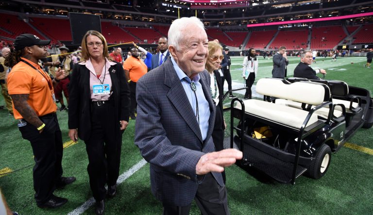 Former President Jimmy Carter and Rosalynn Carter are seen ahead of an NFL football game between the Atlanta Falcons and the Cincinnati Bengals, Sunday, Sept. 30, 2018, in Atlanta. 