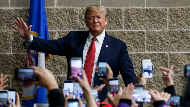President Trump speaks to an overflow crowd during a campaign rally at the Mayo Civic Center.