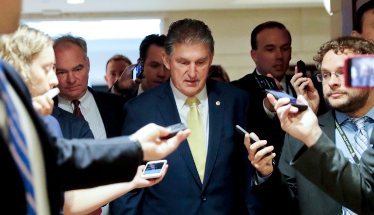 Sen. Joe Manchin, D-W.Va., and Sen. Tim Kaine, D-Va., walk together after viewing the FBI supplemental background report on Supreme Court Justice nominee Brett Kavanaugh in Washington, D.C.