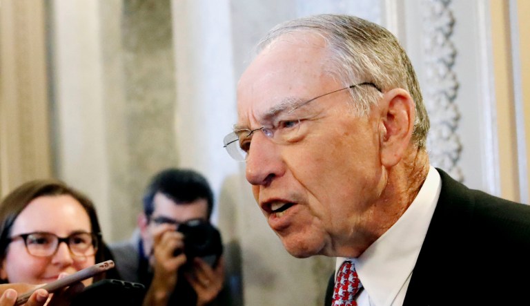 Senate Judiciary Committee Chairman Sen. Chuck Grassley, R-Iowa, right, talks to reporters in Washington.
