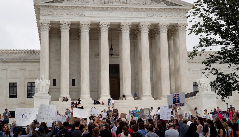 Activists demonstrate in front of the Supreme Court to protest the confirmation vote of Supreme Court nominee Brett Kavanaugh near Capitol Hill on Saturday in Washington.