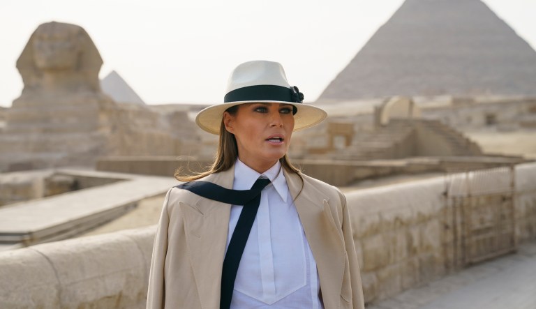 U.S. first lady Melania Trump talks to media as she visits the ancient statue of Sphinx, with the body of a lion and a human head, at the historic Giza Pyramids site in Giza, near Cairo, Egypt, Saturday, Oct. 6, 2018. Trump is visiting Africa on her first big solo international trip.