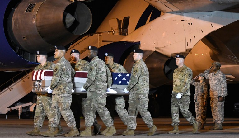An Army carry team moves a transfer case containing the remains of Sgt. James A. Slape at Dover Air Force Base, Del., on Saturday, Oct. 6, 2018. According to the Department of Defense, Slape, 23, of Morehead City, N.C., died Oct. 4, 2018 in Helmand province, Afghanistan, of injuries sustained from an improvised explosive device. 