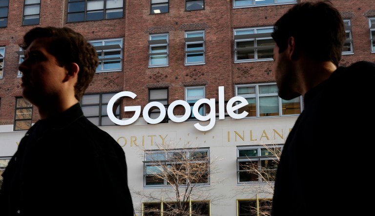 In this Dec. 4, 2017 file photo, people walk by Google offices in New York. Google is closing the consumer version of its long-spurned Plus social network after discovering a bug earlier this year that leaked some of the personal information about up to 500,000 people who still have accounts on the dying service.