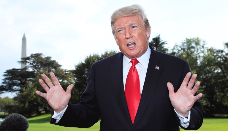 President Trump speaks to reporters on the South Lawn of the White House in D.C.