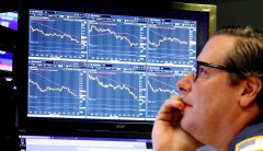 Stock market tumbles, closes out worst year since 2008