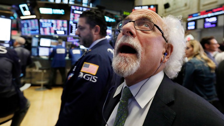 Trader Peter Tuchman works on the floor of the New York Stock Exchange.