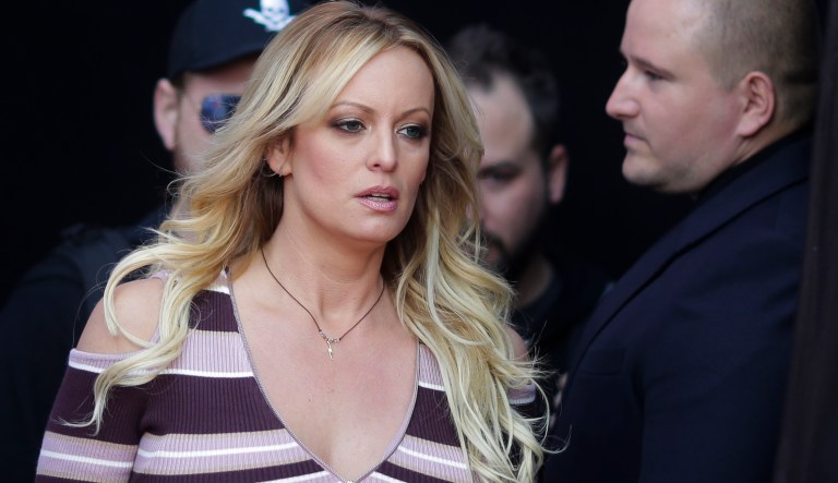 Adult film actress Stormy Daniels, front, arrives for the opening of the adult entertainment fair 'Venus' in Berlin, Germany, Thursday, Oct. 11, 2018.