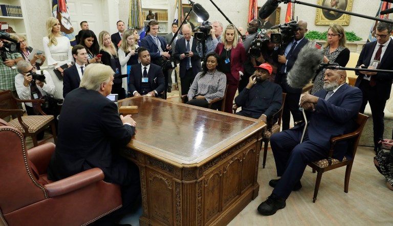 President Trump talks to NFL Hall of Fame football player Jim Brown, seated right, and Rapper Kanye West, seated center, and others in the Oval Office of the White House on Thursday in Washington.