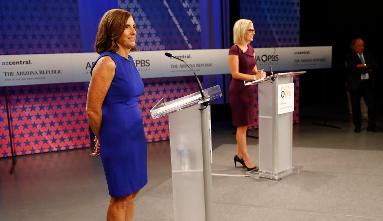 U.S. Senate candidates, U.S. Rep. Martha McSally, R-Ariz., left, and U.S. Rep. Kyrsten Sinema, D-Ariz., prepare their remarks in a television studio prior to a televised debate, Monday, Oct. 15, 2018, in Phoenix. Both ladies are seeking to fill the seat of U.S. Sen. Jake Flake, R-Ariz., who is retiring.