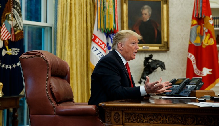 President Donald Trump speaks during an interview with The Associated Press in the Oval Office of the White House, Tuesday, Oct. 16, 2018, in Washington.