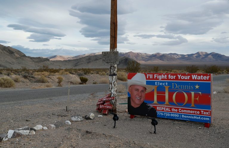 An election sign for Nevada brothel owner Dennis Hof is on display near the Love Ranch brothel, Tuesday, Oct. 16, 2018, in Pahrump, Nev. Hof, a legal pimp and Republican candidate has died according to Nevada Authorities.