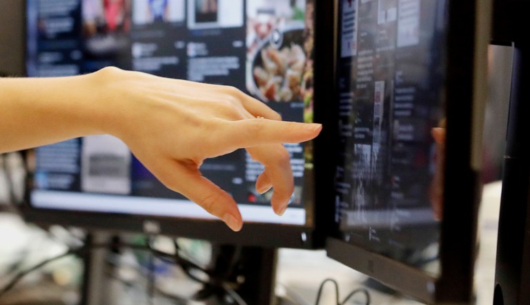 Lexi Sturdy, election war room lead, points to her monitor during a demonstration in the war room, where Facebook monitors election related content on the platform, in Menlo Park, Calif., on Oct. 17, 2018.