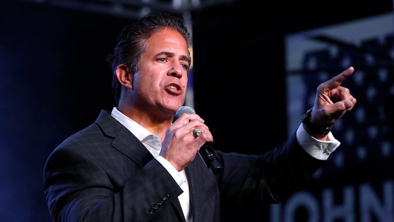 Rep. Mike Bishop, R-Mich. speaks at a rally.