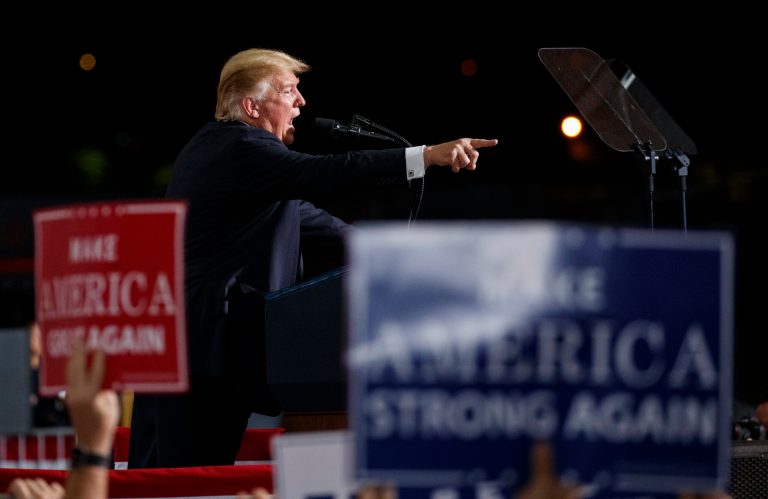 President Donald Trump points as he speaks at a campaign rally at International Air Response, Friday, Oct. 19, 2018, in Mesa, Ariz.
