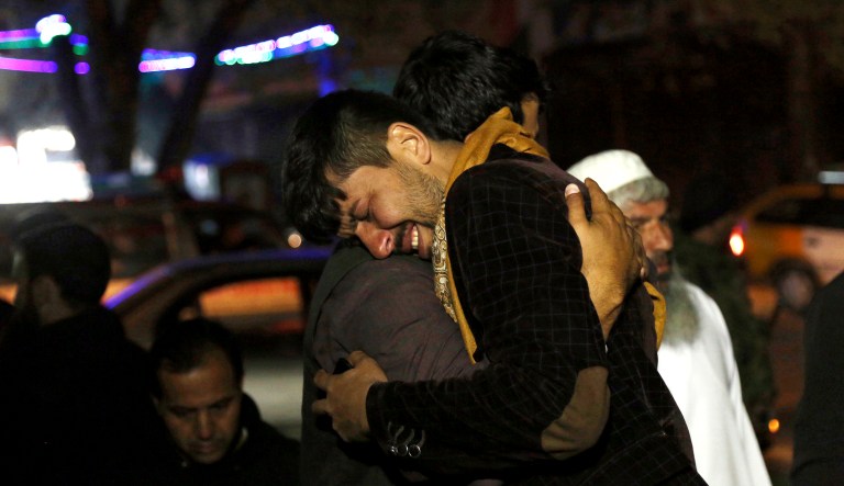 A man cries in front of a hospital after he lost a relative after a suicide attack in Kabul, Afghanistan, Saturday. Police say a suicide bomber blew himself up in front of a polling station in a school in the northern Kabul neighborhood of Khair Khana, the first major attack in Saturday's parliamentary elections.