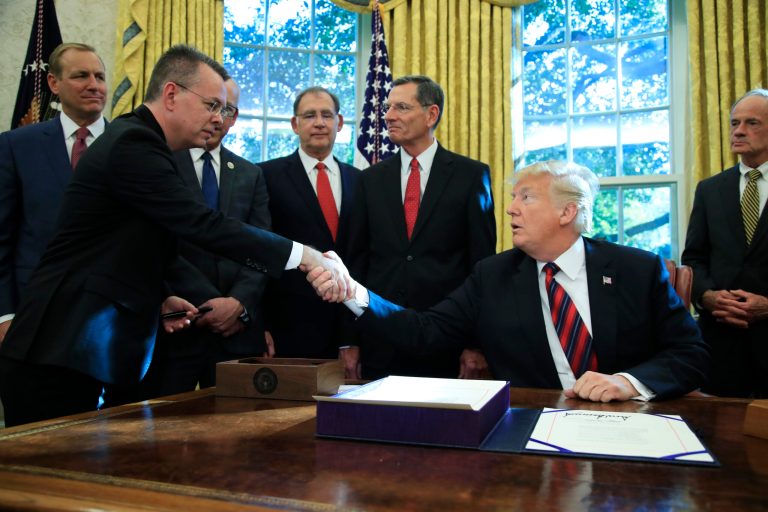 President Trump shakes hands with pastor Andrew Brunson.