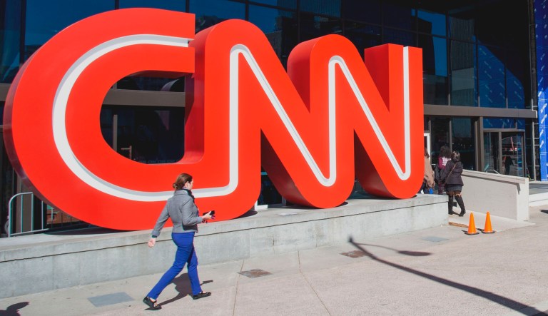 People walk outside CNN Center in Atlanta.