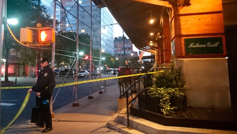 A police officer blocks off an area responding to reports of a suspicious package in the Tribeca neighborhood in New York.