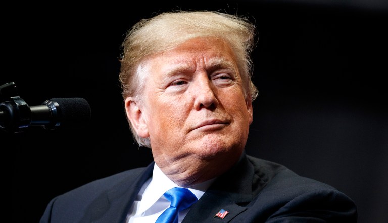 President Trump pauses as he speaks during a campaign rally.