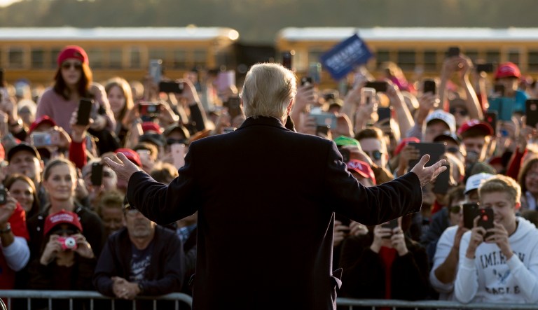 President Trump speaks to an overflow crowd at a rally at Southern Illinois Airport in Murphysboro, Ill., Saturday.